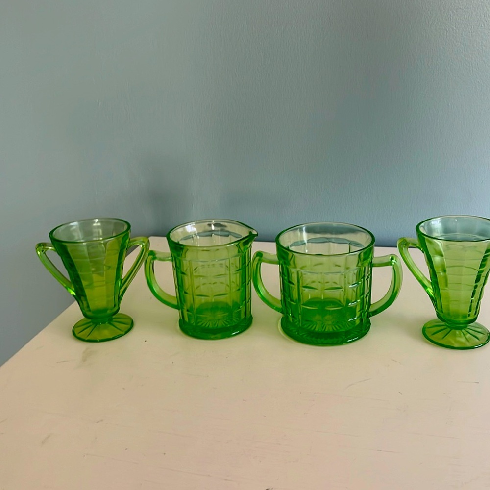 4 pieces of green depression glass.